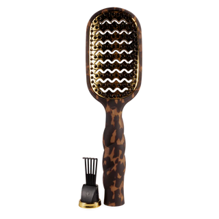 Tortoiseshell paddle hair brush with black bristle head on a white background
