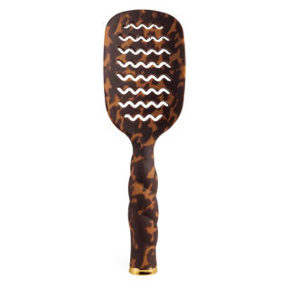 Leopard print paddle hair brush with gold accents on a white background
