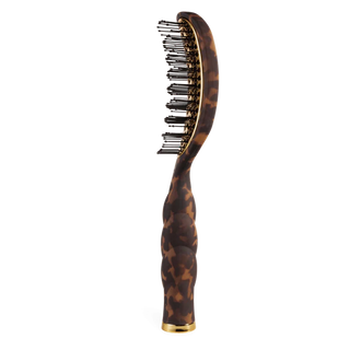 Brown tortoiseshell hairbrush with black bristles on a white background