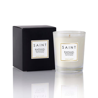 Saint Raphael candle with packaging on a reflective surface